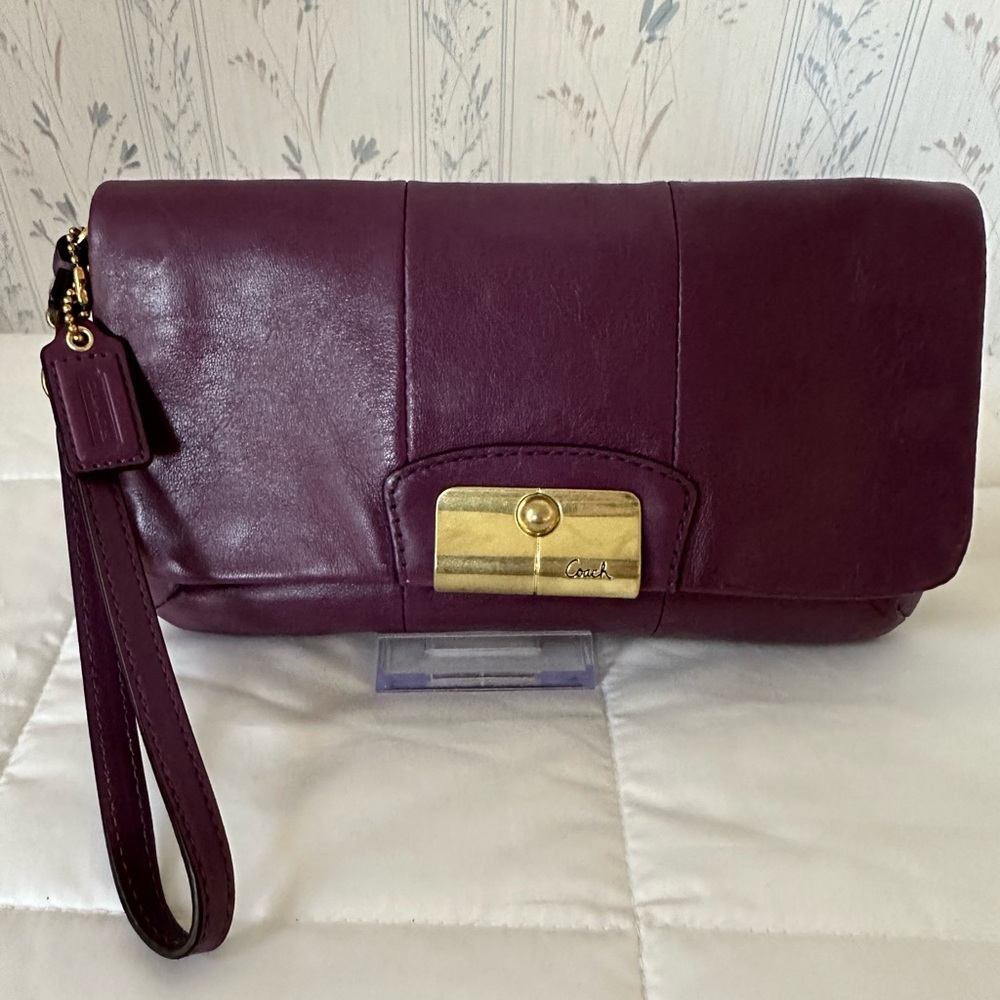 Coach Plum Leather Wristlet with Gold Accents - Picture 1 of 13